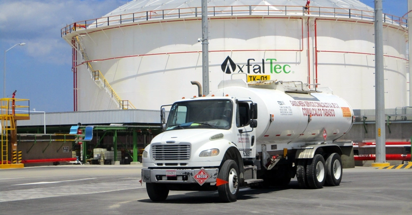 truck in front of storage tank
